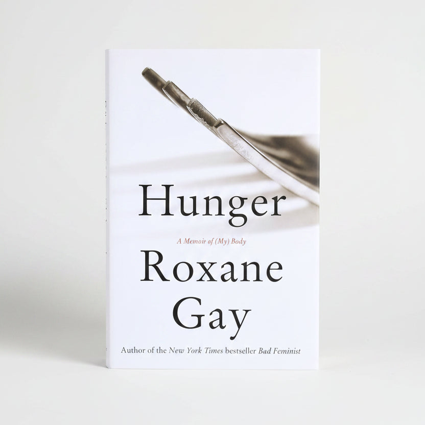 Book cover for 'Hunger: A Memoir of (My) Body' by Roxane Gay, featuring a close-up photograph of a metal syringe tip on a white background with black serif text.