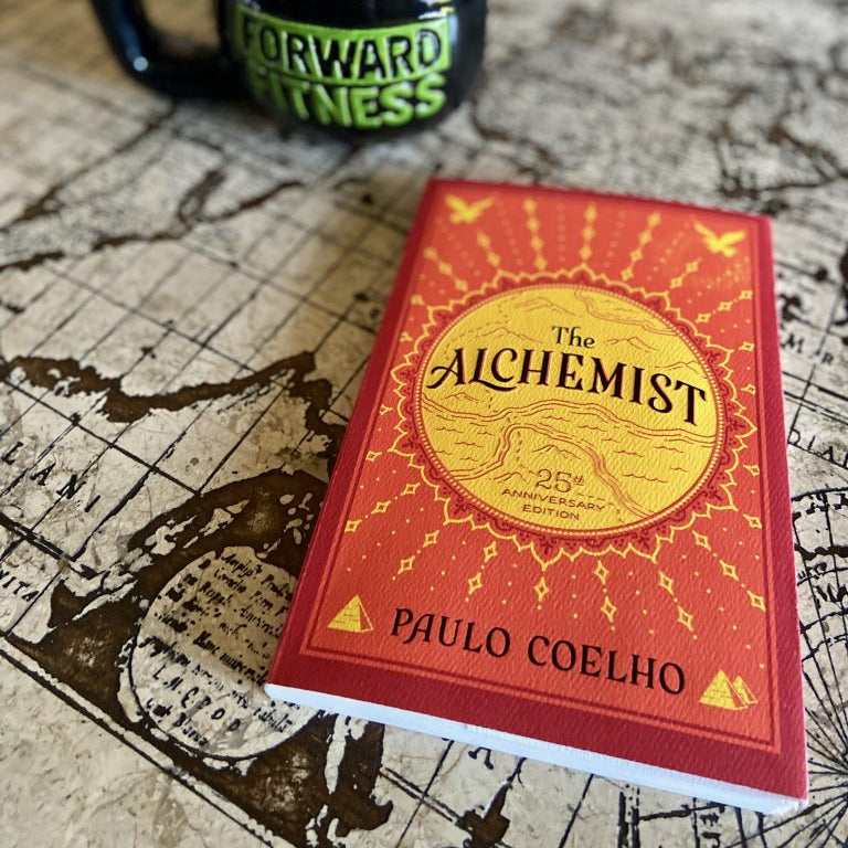 The Alchemist by Paulo Coelho – Paperback Front Cover | Kitab Markaz